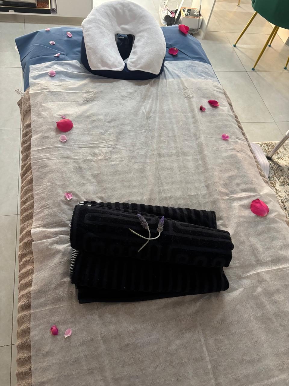 A healing treatment bed dressed with rose petals at Lee Dreams Production House
